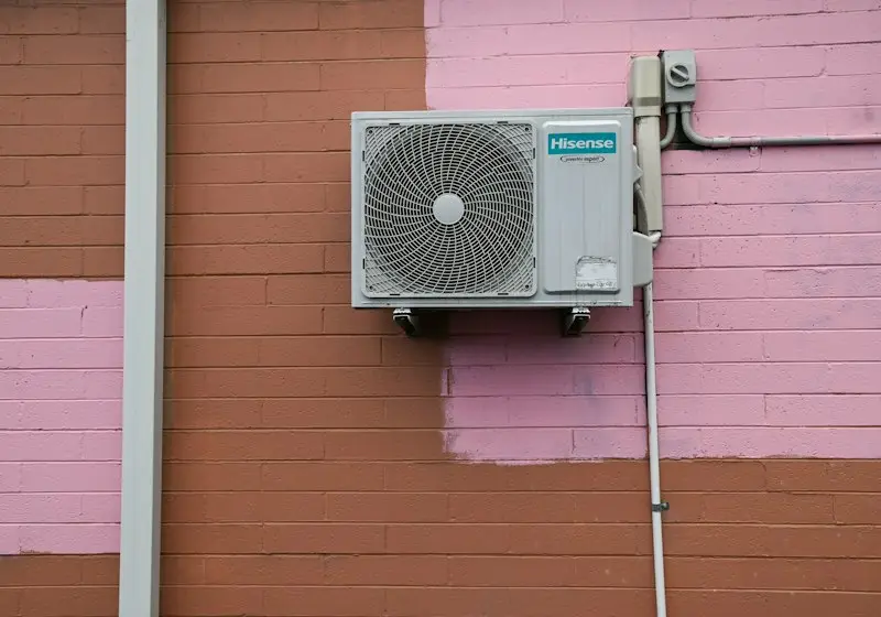 Central air conditioner outside a house